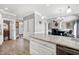 Open kitchen and living area with large kitchen island and stainless steel appliances at 5013 Wheatridge Dr, Fuquay Varina, NC 27526