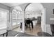 Bright, eat-in kitchen with white cabinets, stainless steel appliances, and a stylish dark island at 5013 Wheatridge Dr, Fuquay Varina, NC 27526