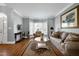 A living room features hardwood floors, neutral colors, and a bay window at 5013 Wheatridge Dr, Fuquay Varina, NC 27526