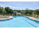 Community pool with lounge chairs and landscaped surroundings, perfect for relaxation at 5013 Wheatridge Dr, Fuquay Varina, NC 27526