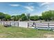 Well-maintained riding arena with sand surface and wooden fencing at 5013 Wheatridge Dr, Fuquay Varina, NC 27526
