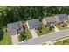 An aerial view shows the well-maintained lawns and home exteriors on a tree-lined street at 509 Holden Forest Dr, Youngsville, NC 27596