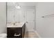 Well-lit bathroom featuring a double sink vanity with neutral counter, stylish fixtures, and a toilet on the right at 509 Holden Forest Dr, Youngsville, NC 27596