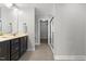 Stylish bathroom features a sleek vanity, modern fixtures, and a glass-enclosed shower for a luxurious experience at 509 Holden Forest Dr, Youngsville, NC 27596