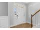 Bright foyer with a transom window and a white front door at 509 Holden Forest Dr, Youngsville, NC 27596