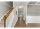 Inviting hallway boasts hardwood floors, staircase and elegant trim, connecting to a spacious living area with a fireplace at 509 Holden Forest Dr, Youngsville, NC 27596