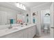 Bright bathroom featuring a double sink vanity and toilet room at 5109 Windance Pl, Holly Springs, NC 27540