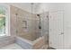 Updated bathroom showcasing a modern walk-in shower with glass enclosure at 5109 Windance Pl, Holly Springs, NC 27540