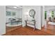 Open-concept space featuring a dining room with hardwood floors, a view of the entry, and hallway at 5109 Windance Pl, Holly Springs, NC 27540