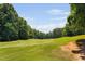 Picturesque view of the golf course showcasing the manicured fairways and beautiful surrounding greenery at 5109 Windance Pl, Holly Springs, NC 27540