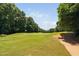 Expansive view of the well-maintained golf course featuring lush green fairways and a pristine landscape at 5109 Windance Pl, Holly Springs, NC 27540