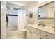 Bright bathroom featuring a shower-tub with a shower curtain and a white vanity at 5205 Coffeetree Dr, Raleigh, NC 27613