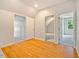 Bedroom featuring wood floors, with multiple doorways leading to other rooms at 5205 Coffeetree Dr, Raleigh, NC 27613