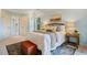 Tastefully decorated bedroom showcasing a large bed with an area rug and bedside tables with lamps at 5205 Coffeetree Dr, Raleigh, NC 27613