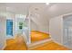 Bedroom with hardwood floors leading to bathroom and loft spaces at 5205 Coffeetree Dr, Raleigh, NC 27613