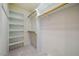 Walk-in closet with built-in shelving offering ample storage space for organization at 5205 Coffeetree Dr, Raleigh, NC 27613