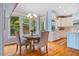 Cozy kitchen dining area with breakfast nook and backyard views at 5205 Coffeetree Dr, Raleigh, NC 27613