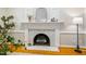 Close up view of fireplace with painted white wood mantle and hearth at 5205 Coffeetree Dr, Raleigh, NC 27613