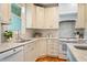 A chef's kitchen with stainless appliances, marble countertops and white cabinets at 5205 Coffeetree Dr, Raleigh, NC 27613