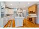Bright kitchen with modern appliances, a breakfast bar, and ample countertop space at 5205 Coffeetree Dr, Raleigh, NC 27613
