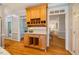 View of built-in buffet cabinet in kitchen with contrasting dark wood at 5205 Coffeetree Dr, Raleigh, NC 27613