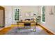 Well-lit office space with hardwood floors, neutral walls, and large windows offering ample natural light at 5205 Coffeetree Dr, Raleigh, NC 27613