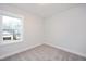 Bedroom with a large window providing natural light and a pleasant view at 524 Folk Song Way, Wendell, NC 27591