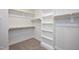 Walk-in closet offers ample shelving and hanging space for organized storage at 524 Folk Song Way, Wendell, NC 27591