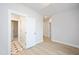 Hallway with views to a bathroom and other bedrooms. Stylish flooring at 524 Folk Song Way, Wendell, NC 27591