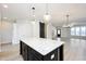 Spacious kitchen with white cabinets, large island, and open floor plan at 524 Folk Song Way, Wendell, NC 27591