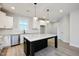 Modern kitchen featuring granite countertops, stainless steel appliances, and an island at 524 Folk Song Way, Wendell, NC 27591