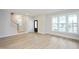 Inviting living room with large windows, light wood floors, and modern trim at 524 Folk Song Way, Wendell, NC 27591