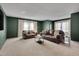 Spacious living room with carpet, neutral walls, and comfortable seating at 5308 Bentgrass Dr, Raleigh, NC 27610