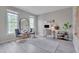 Bright home office featuring hardwood floors, modern furnishings, and plenty of natural light at 5308 Bentgrass Dr, Raleigh, NC 27610