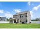 Two-story home featuring large backyard, a patio with seating, and well-maintained lawn at 5637 Garnet Meadow Rd, Knightdale, NC 27545