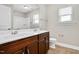 Bathroom featuring double sink vanity, a large mirror, and a toilet at 5637 Garnet Meadow Rd, Knightdale, NC 27545