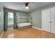bedroom features a unique house frame bed, stylish lighting, and hardwood flooring at 5637 Garnet Meadow Rd, Knightdale, NC 27545