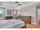 Main bedroom offers hardwood floors, a tray ceiling, decor and dresser storage at 5637 Garnet Meadow Rd, Knightdale, NC 27545