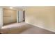 Carpeted bedroom featuring walk-in closet and doorway at 658 Hiawatha Pl, Burlington, NC 27217