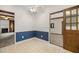 Dining area featuring blue and white walls with tile floors and doorway to another room at 658 Hiawatha Pl, Burlington, NC 27217