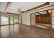 Bright living room with wood floors, wood beam ceilings and multiple windows at 658 Hiawatha Pl, Burlington, NC 27217