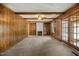 Cozy living room with wood paneling, built-in bookshelves and a fireplace at 658 Hiawatha Pl, Burlington, NC 27217