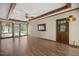 Bright living room featuring wood floors, ceiling fan and multiple windows at 658 Hiawatha Pl, Burlington, NC 27217