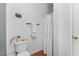 Bathroom featuring toilet, shower with shower curtain, and a door at 800 Savannah Ridge Rd # 109, Holly Springs, NC 27540