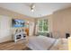 Bright bedroom with wood floors, large window, and an ensuite bathroom for added convenience at 800 Savannah Ridge Rd # 109, Holly Springs, NC 27540