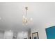 A bright chandelier hanging from the ceiling at 800 Savannah Ridge Rd # 109, Holly Springs, NC 27540