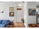 Inviting entryway showcasing artwork and a glimpse into the living area, creating a welcoming ambiance at 800 Savannah Ridge Rd # 109, Holly Springs, NC 27540