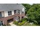 Townhouse featuring brick accents, inviting balcony, and beautifully landscaped surroundings, offering a serene living space at 800 Savannah Ridge Rd # 109, Holly Springs, NC 27540