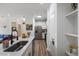 Kitchen features stainless steel appliances, a large sink, and white cabinets at 800 Savannah Ridge Rd # 109, Holly Springs, NC 27540