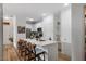 Stylish kitchen with an island breakfast bar, stainless steel appliances, and sleek white cabinetry at 800 Savannah Ridge Rd # 109, Holly Springs, NC 27540